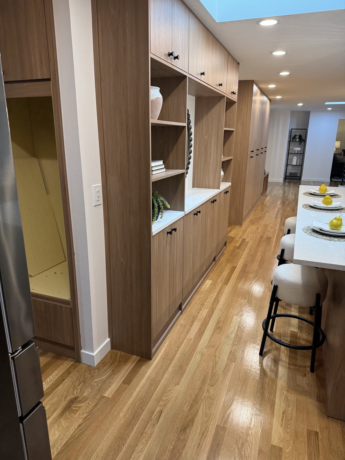 Custom floor-to-ceiling storage and display cabinetry in Mercer Island kitchen