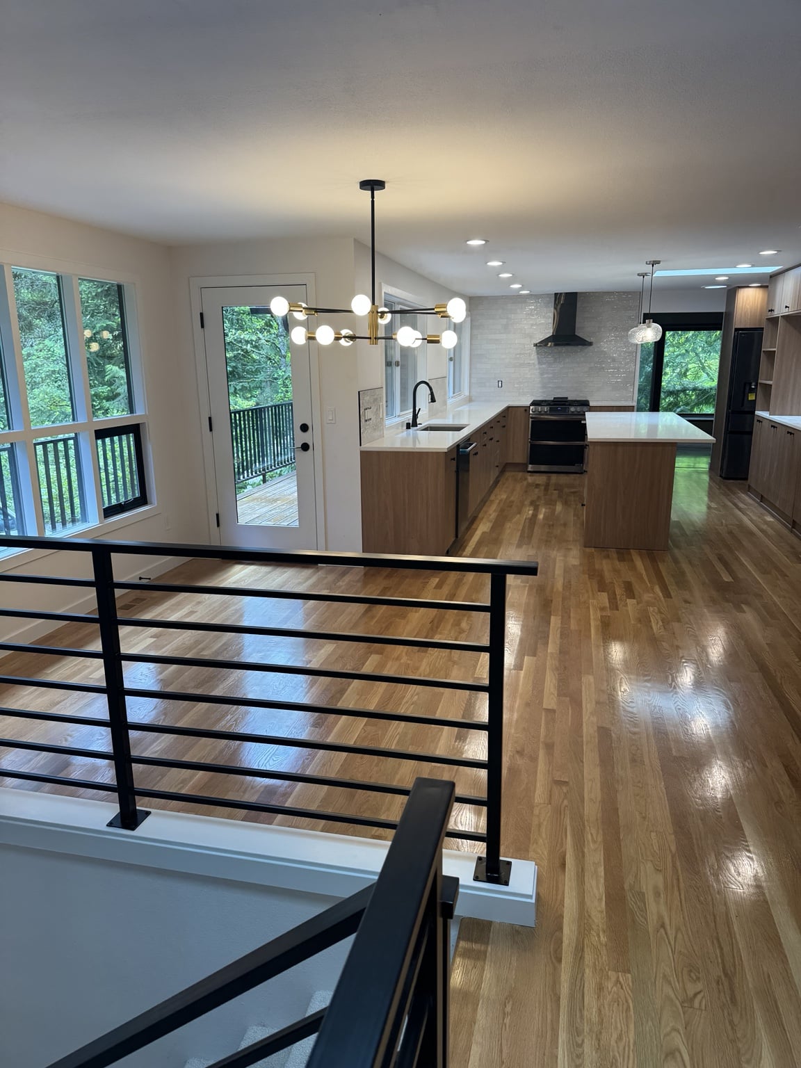 Wide view of completed open-concept Mercer Island kitchen and dining area